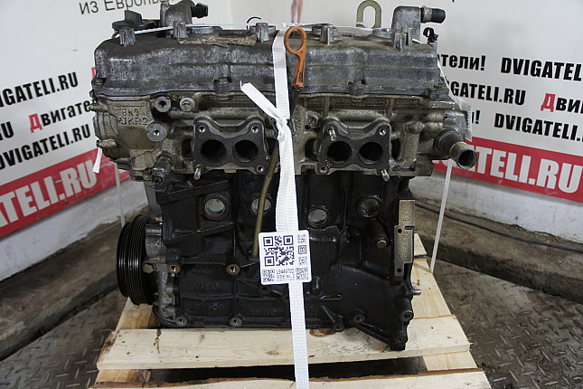 Двигатель вид с боку Nissan QG16DE
