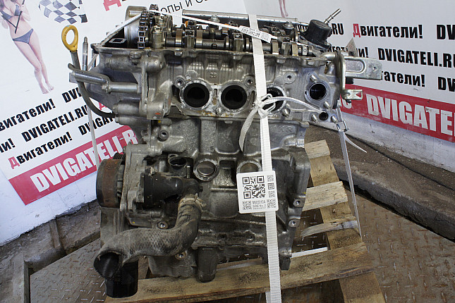 Двигатель вид с боку Toyota 1KR-FE